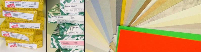 Boxes of Classic Linen and Royal Linen card stock next to a fanned spread of colored and textured papers